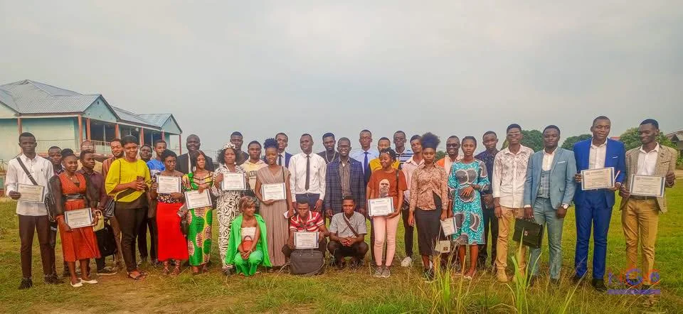 Participants gathered outdoors with certificates.